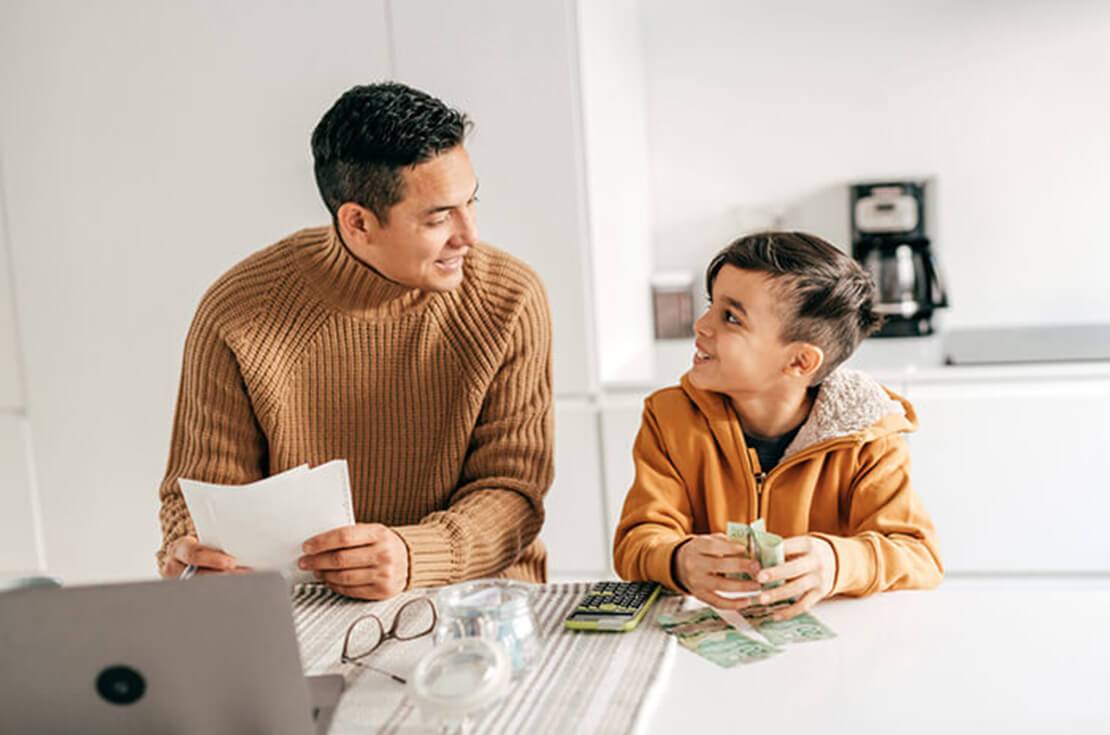 Father teaching his son about money