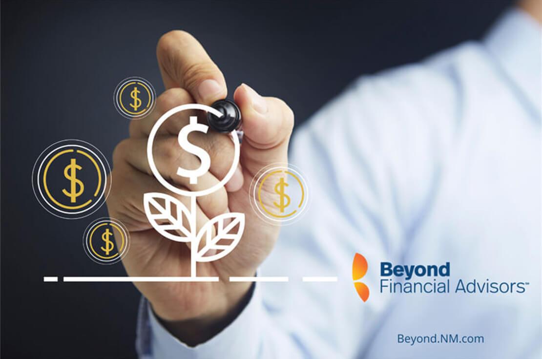 Hand holding a pen with Beyond Financial Advisors logo