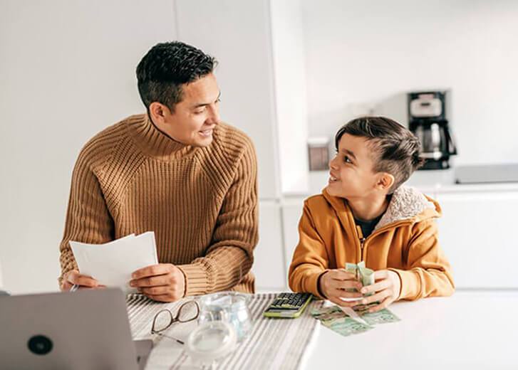 Father teaching his son about money